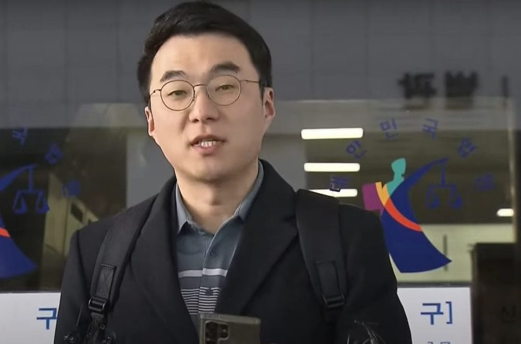 The former lawmaker South Korean Kim Nam-guk speaking to reporters outside a branch of the Seoul Southern District Court.