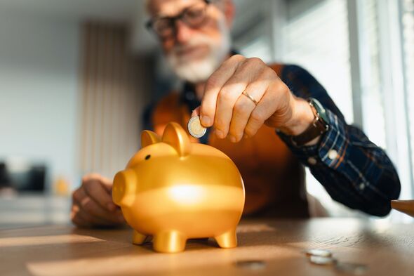 Senior man putting coins, money into a piggy bank. Saving Money after retirement, preparing for retirement. Financial education and financial literacy Senior man putting coins, money into a piggy bank. Saving Money after retirement, preparing for retirement. Financial education and financial literacy