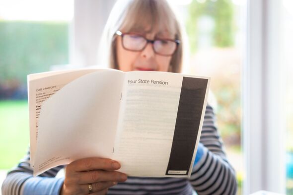 Senior woman reading leaflet about state pension Senior woman reading leaflet about state pension