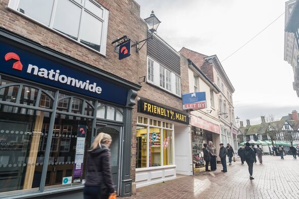 A person walks past a Nationwide branch