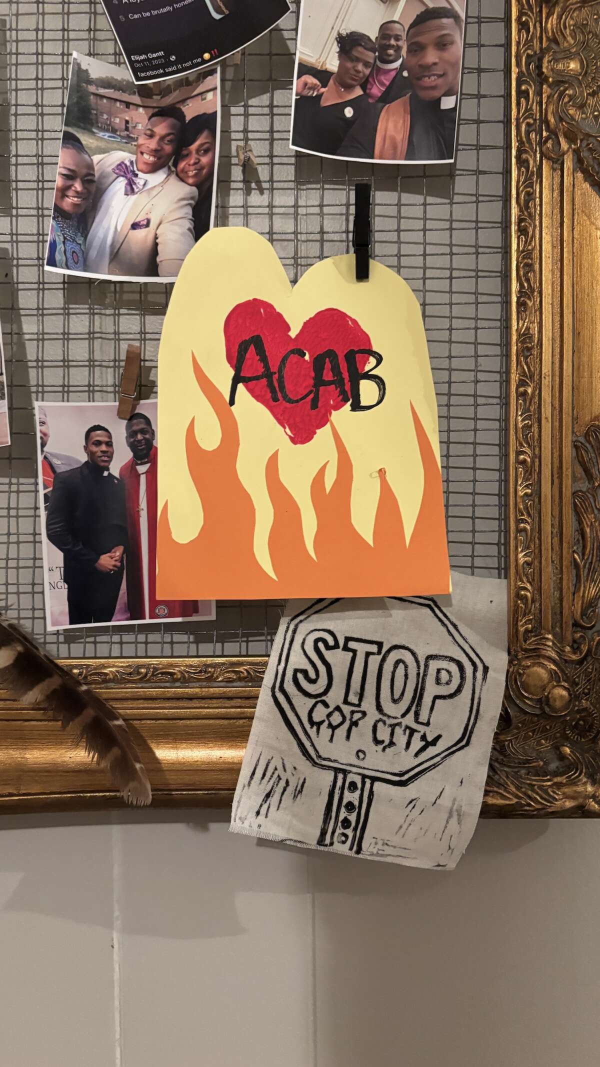 A Photo wall features printed images of Elijah Gantt with friends and family. This photo was taken during a Taco Tuesday fundraiser in St. Louis, Missouri, on July 8, 2025.