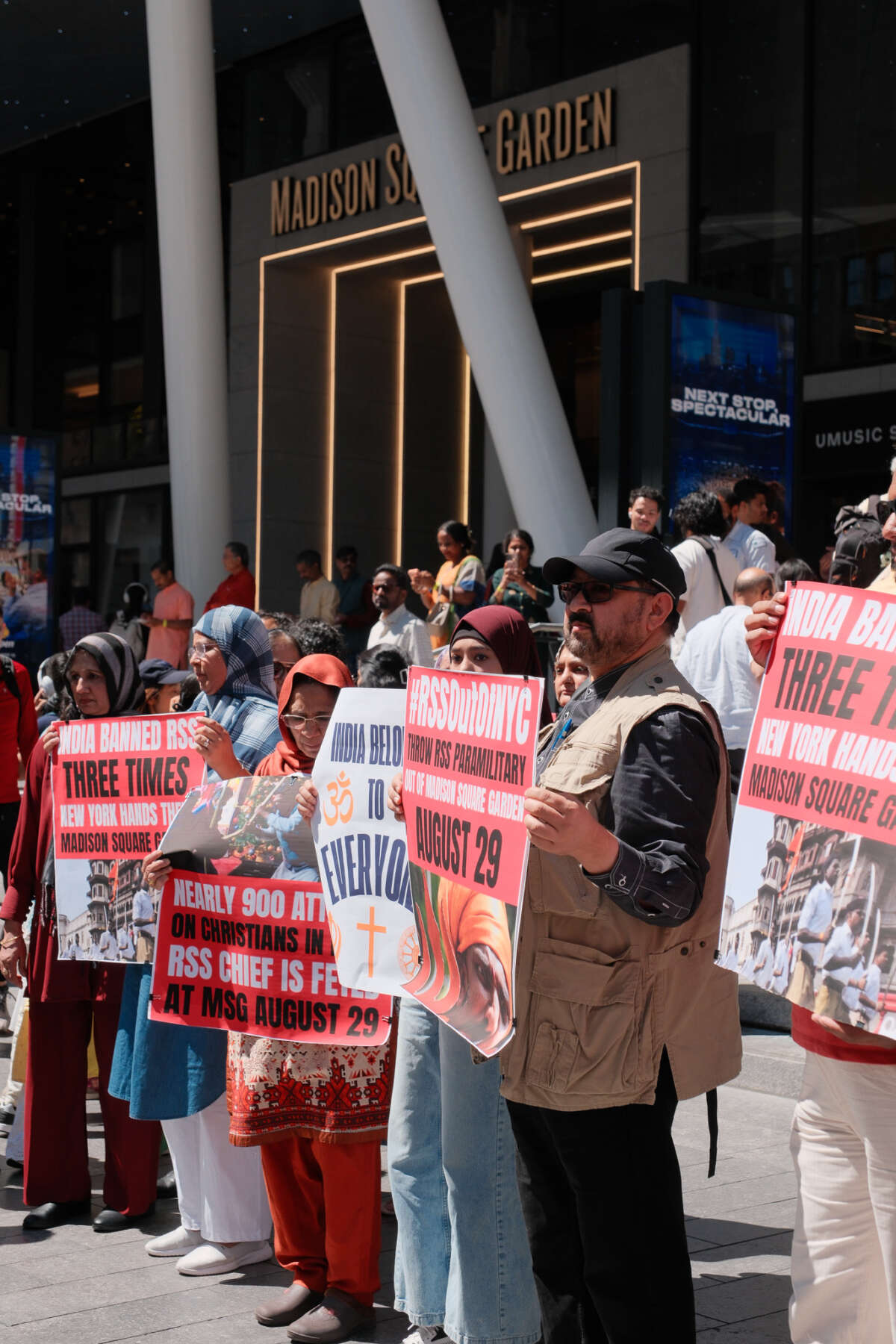 Demonstrators display signs reading, “RSS Out of NYC.”