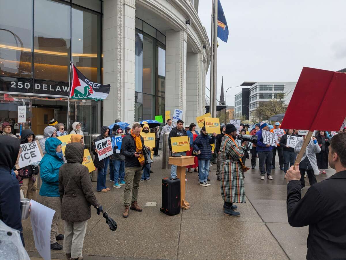 The Evict ICE from 250 Delaware campaign holds its campaign launch in front of Uniland’s Delaware North Building on May Day 2026.