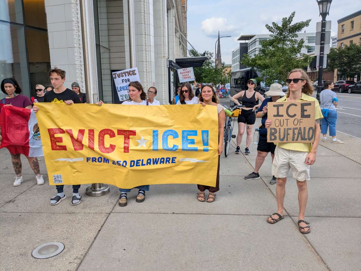 Around 80 people attend a protest and vigil at 250 Delaware building on July 25, organized to honor the life and memories of those who have been killed by ICE and DHS.
