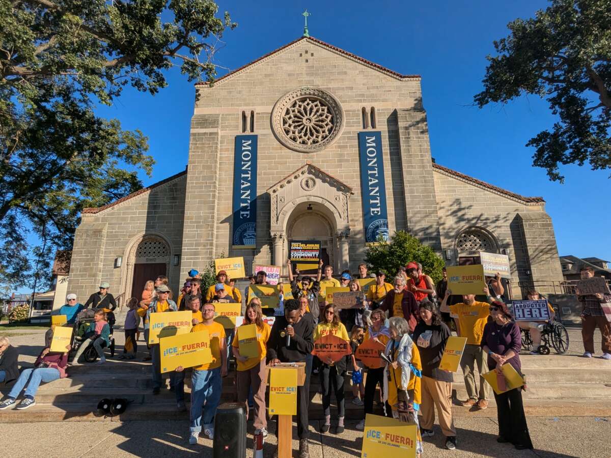 Protesters gather on the steps of the Montante Cultural Center at Canisius University in Buffalo to demand the school pressure the Montantes to not renew ICE’s lease at 250 Delaware.