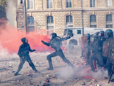 Protesters face police units on Place de la Republique, where clashes broke out involving projectiles and the use of tear gas to disperse the gathering in Paris, France, on October 17, 2026.