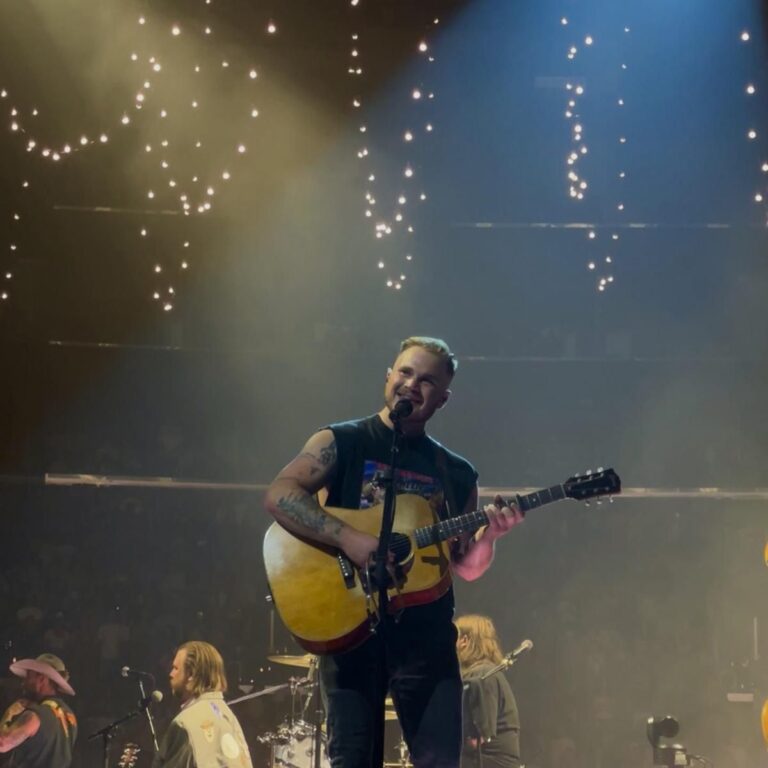 Unlike Sheeran, Zach Bryan read the room and wore the right shirt